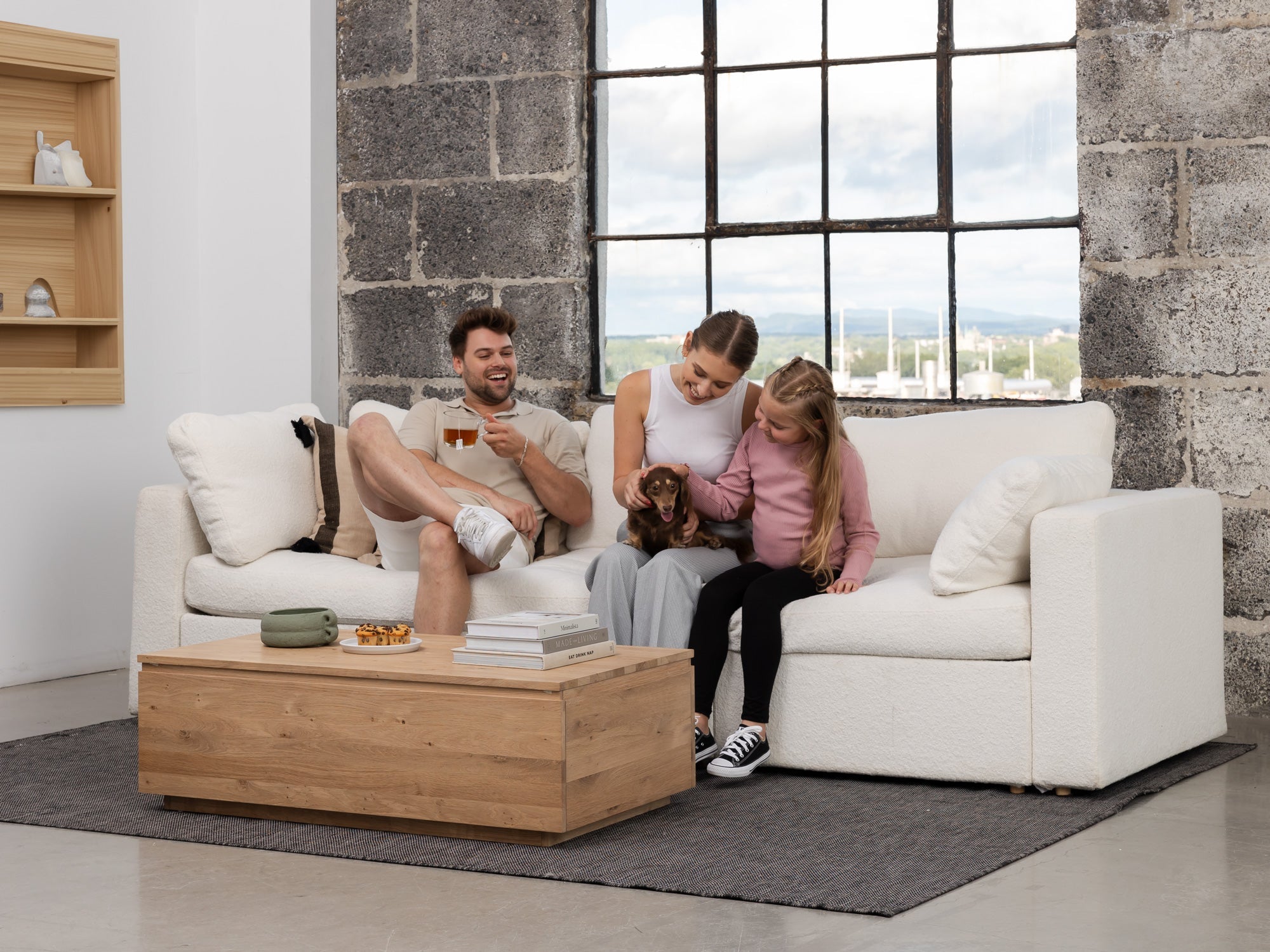 Transformer-table-scandinavian-oak-coffee-table-closed-lifestyle-model Transformer Coffee Table - Panel Storage - Image 1